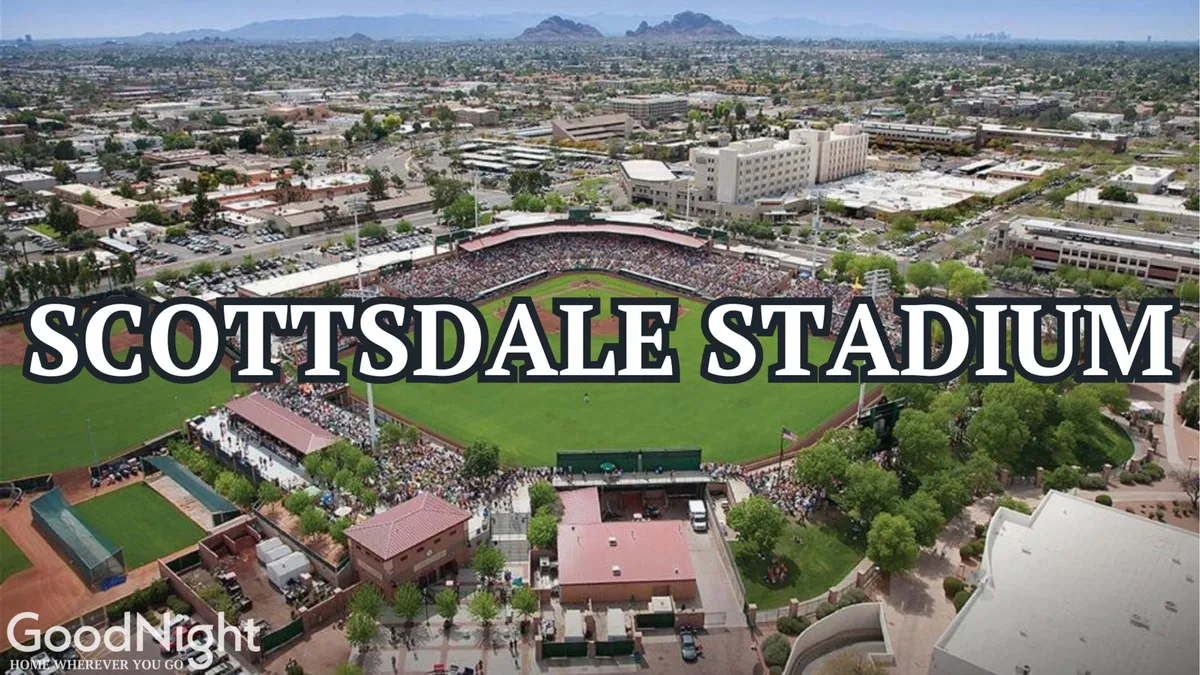 A vibrant shot of Scottsdale Stadium bustling with spectators, a lush green baseball field, and the surrounding cityscape. The excitement of a live game day is palpable, with the sense of community and local pride on full display.